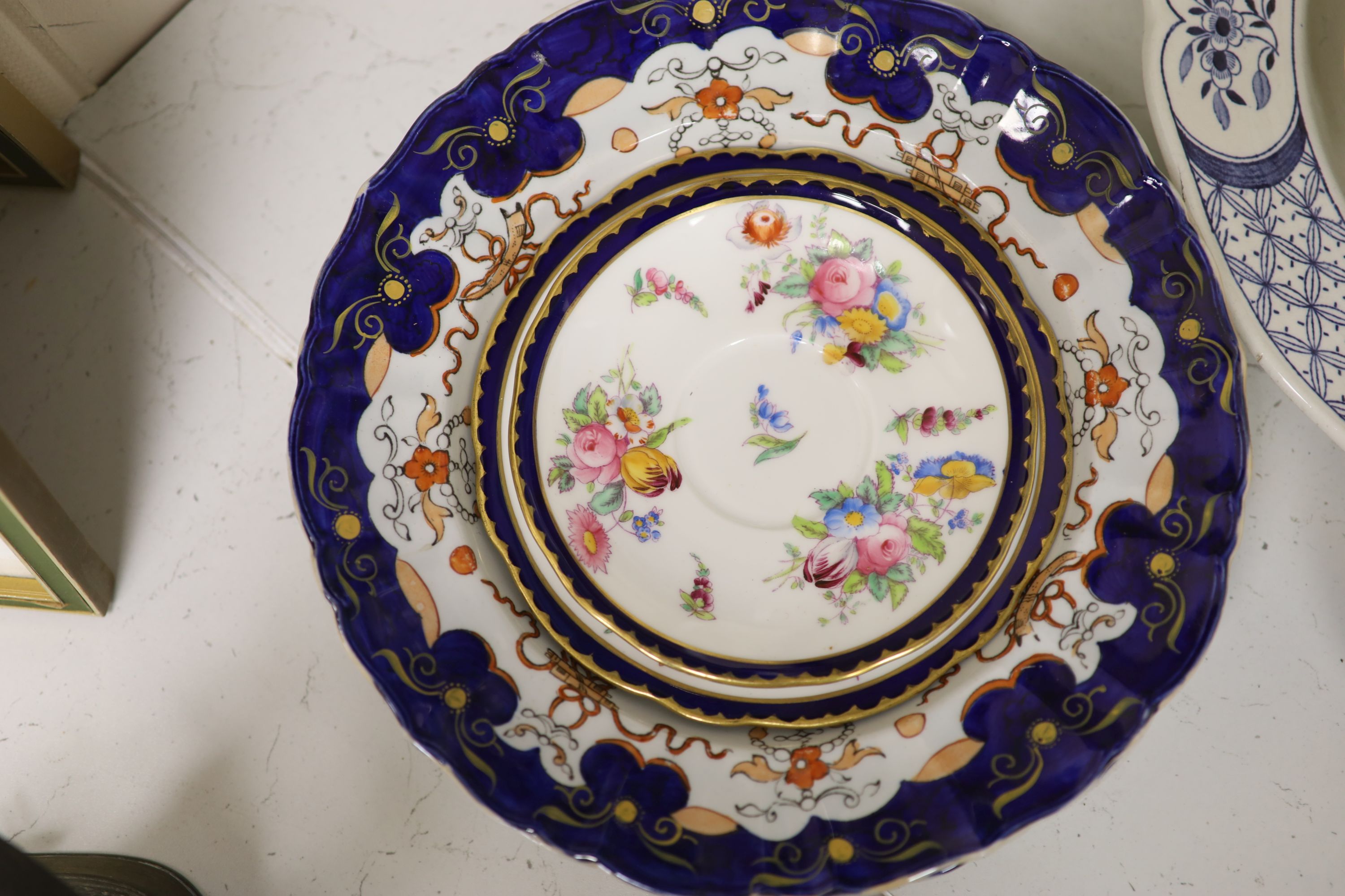 A Coalport cobalt blue dish with painted reserve of Kilchurn, heightened in gilt and sundry ceramics,